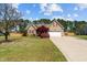 Charming single-Gathering home with a two-car garage, mature trees, and well-manicured lawn at 140 Adams Pointe Ct Ct, Angier, NC 27501
