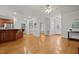 Open-concept living space with hardwood floors and seamless transitions to the kitchen at 140 Adams Pointe Ct Ct, Angier, NC 27501