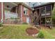 Beautiful backyard with a screened-in porch, garden beds, and lush landscaping at 1403 Vickers Ave, Durham, NC 27707