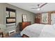 Cozy bedroom featuring a comfortable bed, wooden furniture, and a pass-through to a sunroom area at 1403 Vickers Ave, Durham, NC 27707