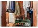 Functional closet with wooden walls, displaying organized clothing and shoe storage at 1403 Vickers Ave, Durham, NC 27707
