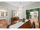 Bright dining room featuring a modern chandelier, hardwood floors, and views of the living areas at 1403 Vickers Ave, Durham, NC 27707