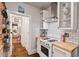 Quaint kitchen features subway tile backsplash, wooden countertops, and stainless steel appliances at 1403 Vickers Ave, Durham, NC 27707