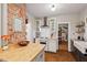 Charming kitchen with exposed brick, a farmhouse sink, and an open layout at 1403 Vickers Ave, Durham, NC 27707
