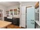 Bright kitchen with butcher block countertops, a Smeg refrigerator, and ample storage at 1403 Vickers Ave, Durham, NC 27707