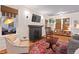 Bright living room featuring a fireplace, a large window, and cozy seating at 1403 Vickers Ave, Durham, NC 27707