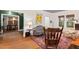 Cozy living room featuring hardwood floors, a vibrant rug, and a large window at 1403 Vickers Ave, Durham, NC 27707