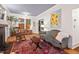 Open living room with hardwood floors, a fireplace, and ample natural light at 1403 Vickers Ave, Durham, NC 27707