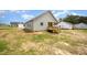 Home featuring a covered back porch and a partially sodded backyard in a new neighborhood at 152 Royal Ave, Selma, NC 27576
