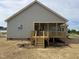 Rear view of home with a wooden deck and gray siding, great for outdoor enjoyment at 152 Royal Ave, Selma, NC 27576