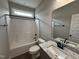 Full bathroom with a shower-tub combination, granite countertop, and modern fixtures at 152 Royal Ave, Selma, NC 27576