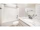 Full bathroom featuring tub with shower and modern sink with granite countertop at 152 Royal Ave, Selma, NC 27576