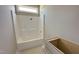 Bathroom featuring a white bathtub/shower combo with the vanity ready for installation at 152 Royal Ave, Selma, NC 27576