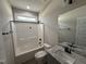 Bright bathroom featuring a granite vanity, shower-tub combo, and modern fixtures at 152 Royal Ave, Selma, NC 27576