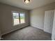 Cozy bedroom with natural light from large window, and a spacious closet at 152 Royal Ave, Selma, NC 27576