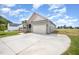 Well-maintained home boasts a spacious driveway and an attached two-car garage at 152 Royal Ave, Selma, NC 27576