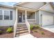 Inviting front porch with brick steps enhances the curb appeal of this charming home at 152 Royal Ave, Selma, NC 27576