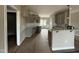 Well-lit kitchen featuring granite countertops, gray cabinets, and a convenient center island at 152 Royal Ave, Selma, NC 27576