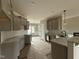 Modern kitchen with granite countertops, gray cabinets, a stylish backsplash, and an island at 152 Royal Ave, Selma, NC 27576