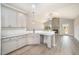 Bright open kitchen featuring granite countertops, ample cabinets, and wood flooring at 152 Royal Ave, Selma, NC 27576