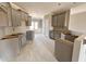 Spacious unfinished kitchen with ample cabinet space and natural light at 152 Royal Ave, Selma, NC 27576