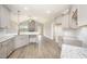 Open-concept kitchen with granite countertops, stylish cabinets, and views of living area at 152 Royal Ave, Selma, NC 27576