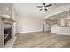 Open-concept living room with fireplace seamlessly connects to the modern kitchen at 152 Royal Ave, Selma, NC 27576