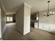 Open concept living space with large windows, fireplace and access to the kitchen at 152 Royal Ave, Selma, NC 27576