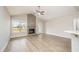 Bright living room features a vaulted ceiling, fireplace, and hardwood floors at 152 Royal Ave, Selma, NC 27576