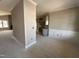 Bright living room with decorative trim and an open floor plan that connects to the kitchen at 152 Royal Ave, Selma, NC 27576