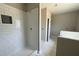 Unfinished bathroom featuring a shower with white subway tile and accent niche at 152 Royal Ave, Selma, NC 27576