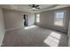 Bright and spacious main bedroom with carpet, ceiling fan, and natural light at 152 Royal Ave, Selma, NC 27576