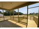 View from covered patio with wooden railings, overlooking the back yard at 152 Royal Ave, Selma, NC 27576