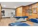 Wide shot of a basement with wood-look flooring, featuring exercise equipment and wood-paneled walls at 1602 Lake Shore Dr, Dunn, NC 28334