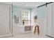 Bright bathroom featuring a glass shower, soaking tub, white tile, and black fixtures at 1602 Lake Shore Dr, Dunn, NC 28334