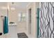 Bright bathroom showcasing a white vanity, marble flooring, and natural light from the window at 1602 Lake Shore Dr, Dunn, NC 28334