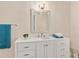 Bright bathroom features a white vanity with ample storage, stylish mirror, and modern fixtures at 1602 Lake Shore Dr, Dunn, NC 28334