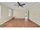 Large bedroom featuring natural light, hardwood floors, and a modern ceiling fan at 1602 Lake Shore Dr, Dunn, NC 28334