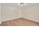 Bedroom with natural light, neutral walls, wood floors, and a large closet at 1602 Lake Shore Dr, Dunn, NC 28334