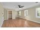 Spacious bedroom with natural light, hardwood floors, closet and two windows at 1602 Lake Shore Dr, Dunn, NC 28334