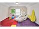 Fun bedroom featuring a teepee, unique decor, and bright carpet at 1602 Lake Shore Dr, Dunn, NC 28334