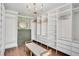 Large walk-in closet with custom shelving, drawers, and a vanity area at 1602 Lake Shore Dr, Dunn, NC 28334