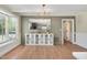 Dining room with natural light, wood flooring, and a decorative light fixture at 1602 Lake Shore Dr, Dunn, NC 28334