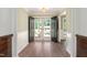 Bright foyer with hardwood floors, double doors, and a view of the front yard at 1602 Lake Shore Dr, Dunn, NC 28334