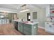 Updated kitchen showcases a large island with seating, modern appliances, and a seamless open-concept design at 1602 Lake Shore Dr, Dunn, NC 28334