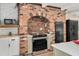 Modern kitchen featuring stainless steel appliances, brick oven surround, custom cabinets and stylish countertops at 1602 Lake Shore Dr, Dunn, NC 28334