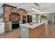 Updated kitchen showcases a large island with seating, modern appliances, and a seamless open-concept design at 1602 Lake Shore Dr, Dunn, NC 28334