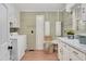 Well-lit laundry room with countertop space, cabinets and a washing machine at 1602 Lake Shore Dr, Dunn, NC 28334