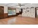 Comfortable living room with beamed ceilings, hardwood floors, and bright natural light at 1602 Lake Shore Dr, Dunn, NC 28334
