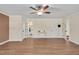 Spacious living room features hardwood floors, ceiling fan, and easy access to the rest of the house at 1602 Lake Shore Dr, Dunn, NC 28334